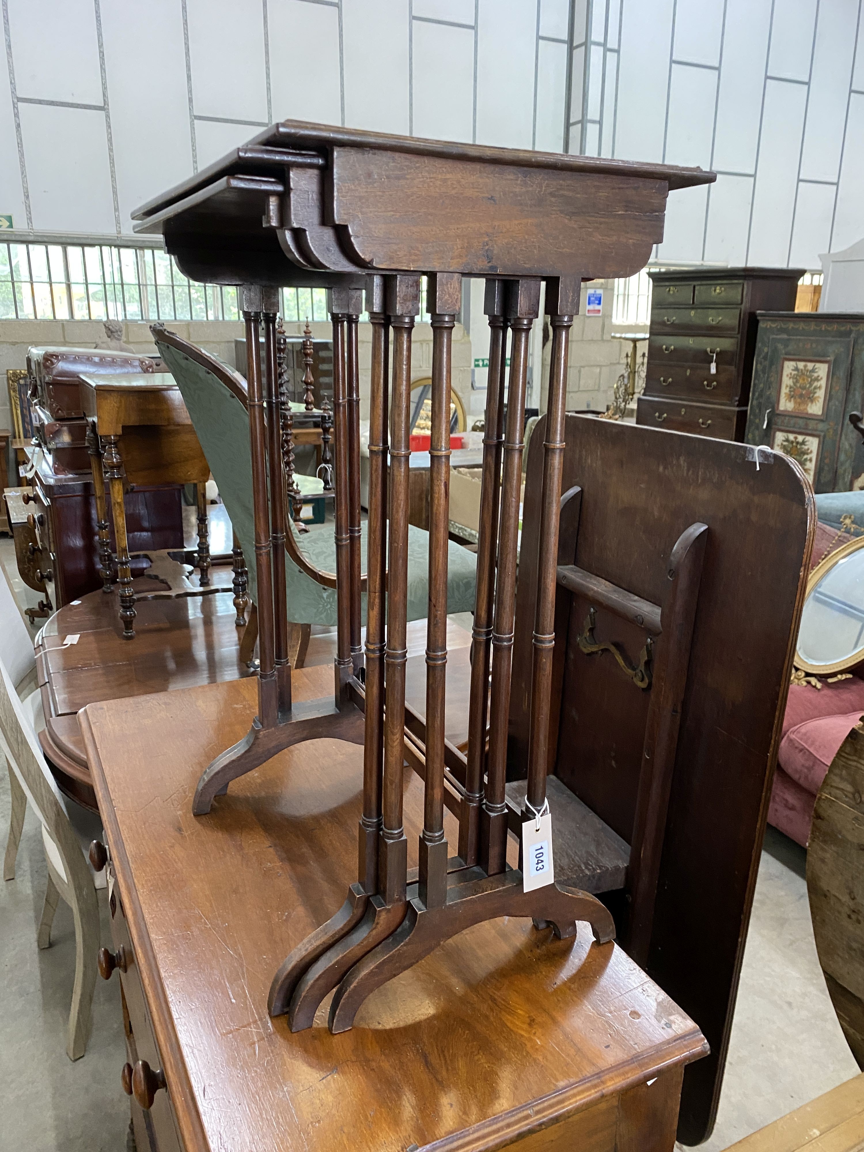 A nest of three Edwardian rectangular mahogany tea tables, width 50cm, depth 38cm, height 76cm